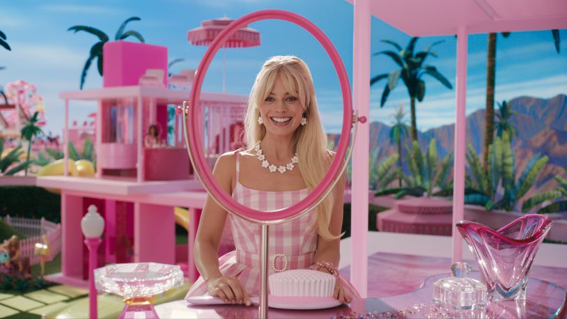 Margot Robbie as Barbie on the very pink set of “Barbie.” (Warner Bros. Pictures/TNS)