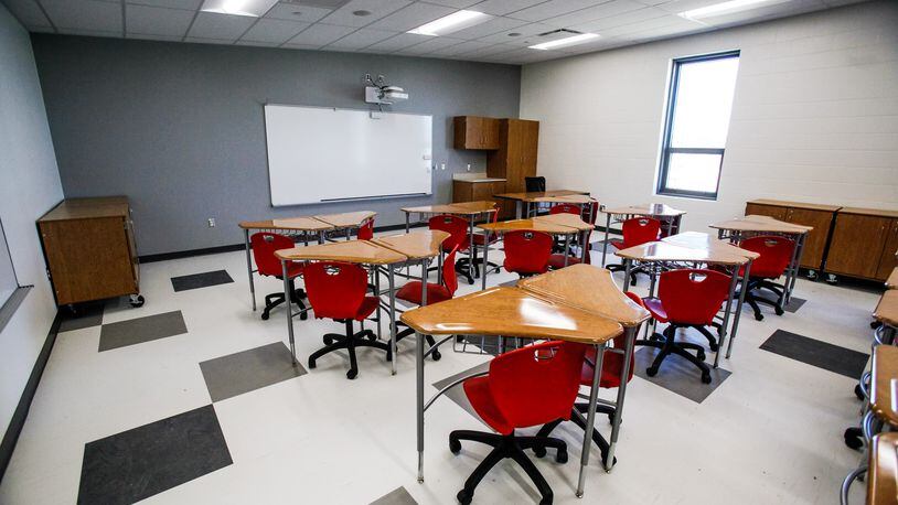 Classrooms like this one may sit empty this fall if schools follow Public Health Dayton-Montgomery County's recommendation to begin the year online.  NICK GRAHAM / STAFF