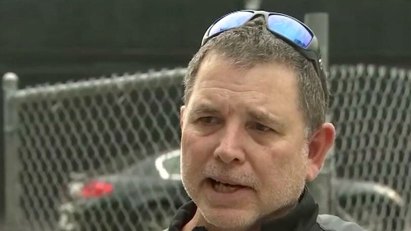 The Seminole High School head baseball coach who was fired after a video surfaced of him cursing during a celebratory speech after the team won a state championship for the first time in decades has gotten his job back.