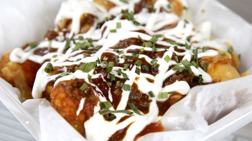 Tot-Chos at Underdogs Mobile are topped with seasoned beef, cheese, salsa, sour cream and green onion. LISA POWELL / STAFF