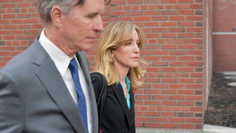 FILE PHOTO: Felicity Huffman exits the John Joseph Moakley U.S. Courthouse after appearing in Federal Court to answer charges stemming from college admissions scandal on April 3, 2019 in Boston, Massachusetts.