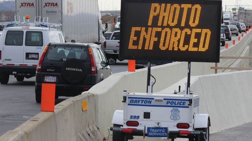 The City of Dayton has begun mobile speed enforcement with cameras on I-75 through the construction zone. Lighted billboards and an unmanned Dayton Police Cruiser were on the southbound side on Thursday. CHUCK HAMLIN / STAFF
