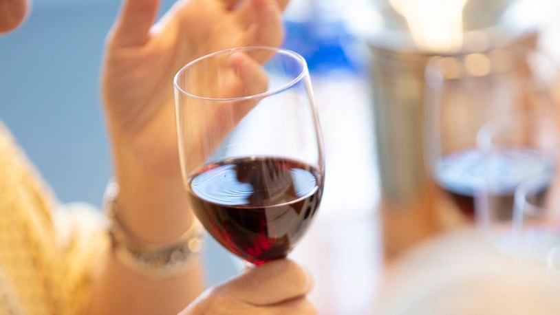 FILE -- Tasting a red wine in New York on Sept. 26, 2019. Moderate drinking is unlikely to impair the immune response to the COVID-19 vaccine, but heavy drinking might. (Tony Cenicola/The New York Times)