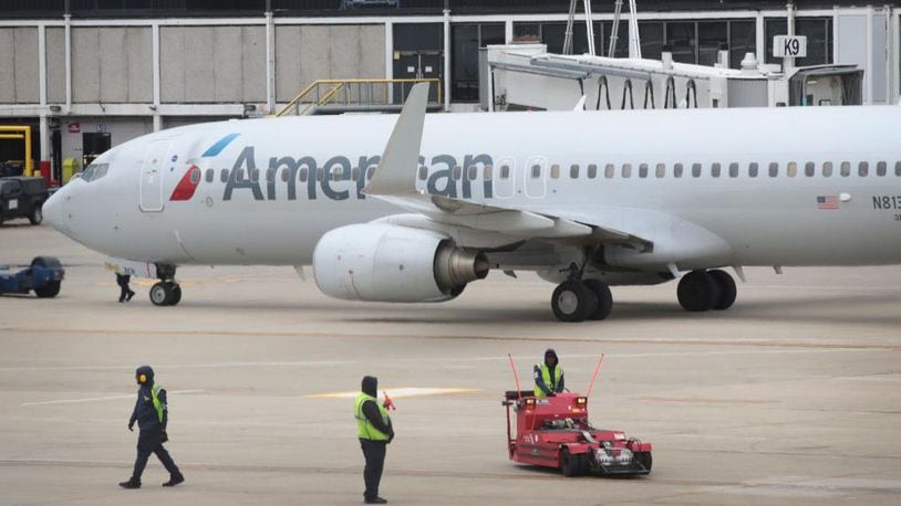A baggage handler told police he was drunk when he fell asleep in a American Airlines plane's cargo hold.