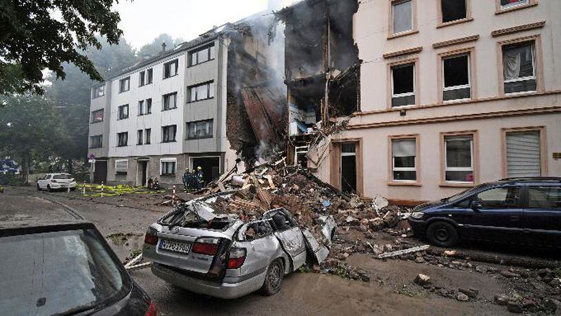 A car and a house are destroyed after an explosion in Wuppertal, Germany, June 24, 2018. (Henning Kaiser/dpa via AP)