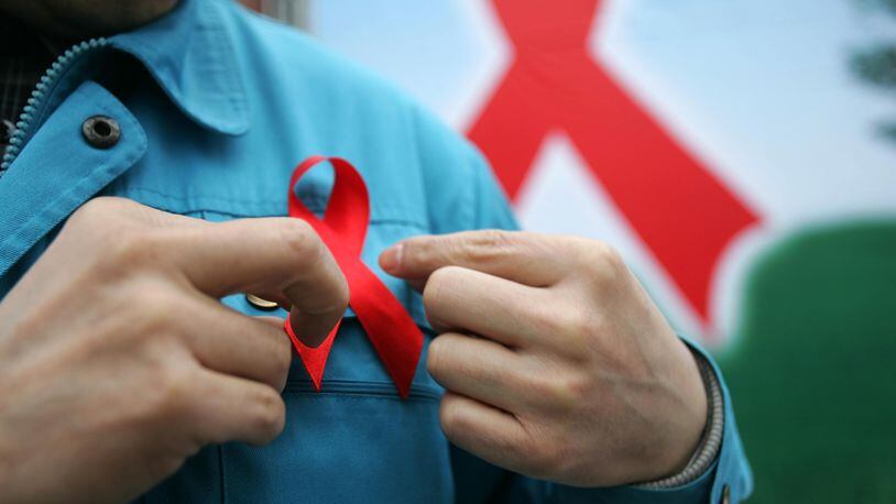 A red ribbon symbolizes the campaign to raise awareness about the potentially deadly consequences of stroke.
