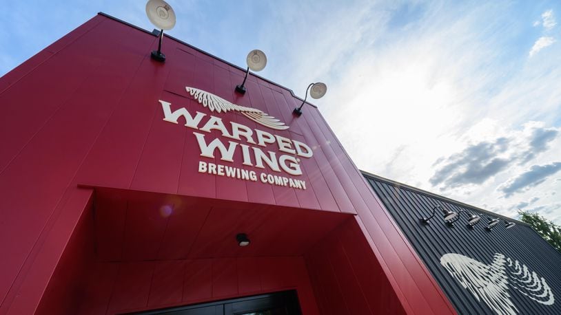 Warped Wing Brewing Company is holding a grand opening for its newest brewery and taproom location in Huber Heights on Friday, June 16. TOM GILLIAM / CONTRIBUTING PHOTOGRAPHER