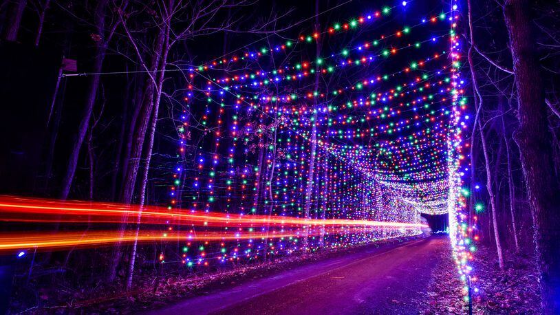 The Land of Illusion Christmas Glow on Thomas Road in Madison Township is open nightly through December with over 3.5 million lights in a 1.5 mile drive-through light display.  This is one of several light tunnels on the path. NICK GRAHAM/STAFF