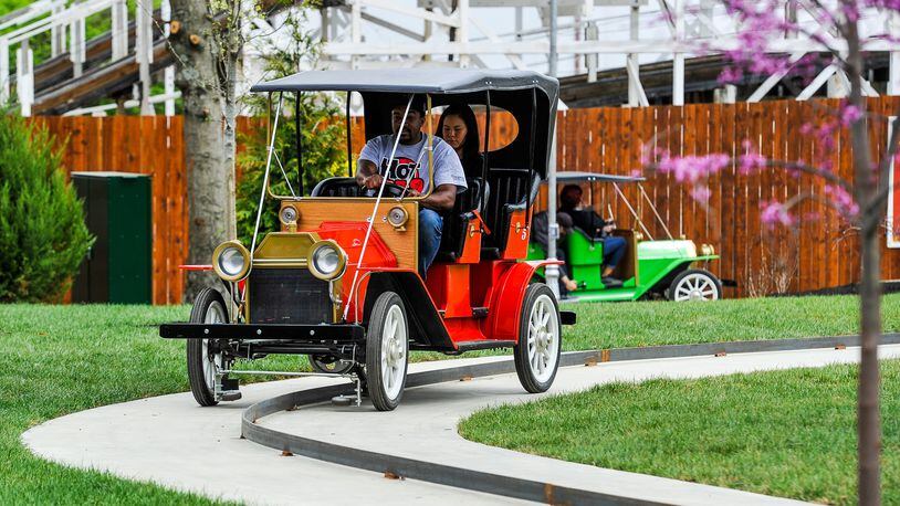 Kings Mills Antique Autos, a ride at Kings island, allows guests to drive a two-thirds-scale 1911 Ford Model T around a scenic quarter-mile track equipped with a small rail to keep the car on path.  NICK GRAHAM/FILE