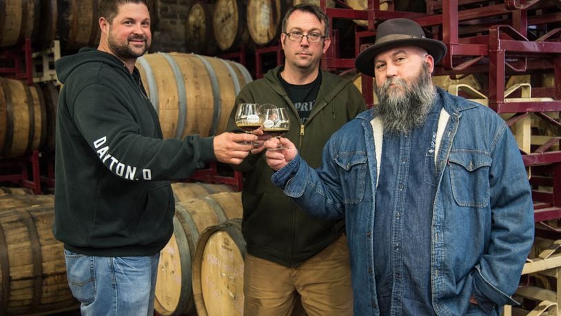 Warped Wing Brewing Co.  and the Century Bar have partner for  Kette's Pride. The rye whiskey barrel aged porter will be the only beer sold in Kette's Kandies Spirited Treats, a planned speakeasy behind The Century Bar. Century Bar co-owner Joe Head (far right) is pictured with Nick Bowman and John Haggerty  of Warped Wing. Photo submitted by Warped Wing.