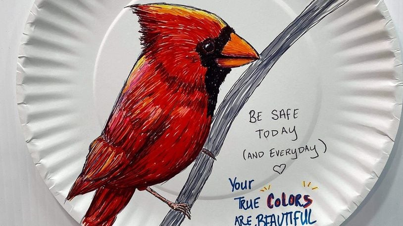 Paper plate artist Lindsey Ray has been brightening the lives of her Costco co-workers during the pandemic with whimsical drawings of animals and inspirational sayings. “I love trying to cheer people up with my artwork,” she says. CONTRIBUTED