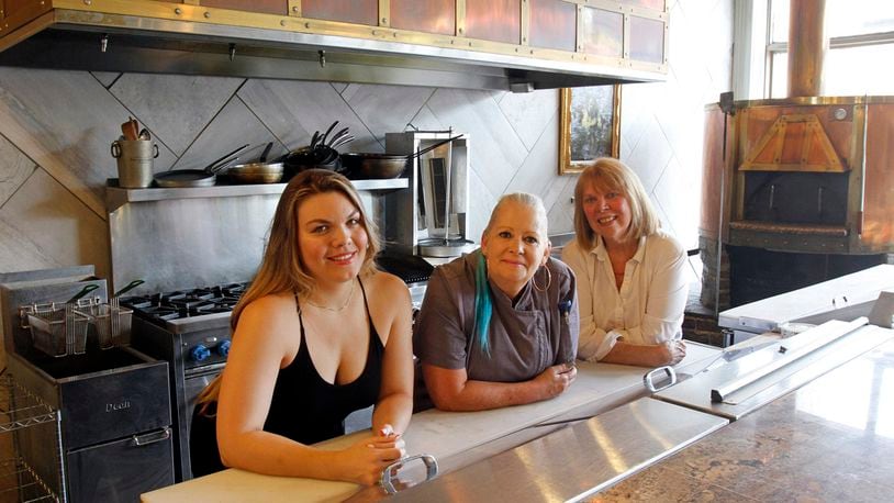 Cafe 1610 co-founders (l-r) Molly Blackshear, Xtine Brean and Cathy Mong in the new vegan restaurant scheduled to open to the public Saturday, Sept. 5.  Photograph by Skip Peterson