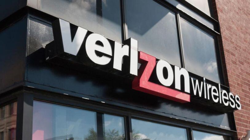 A Verizon sign hangs outside a store in Chicago. A Pennsylvania woman called police when a nude photo on her phone was sent to an unknown number. A Verizon worker is facing charges.