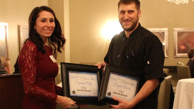 Aaron Braun receives accepts his two awards at the Ohio Pork Council’s Taste of Elegance Chefs Competition. SUBMITTED