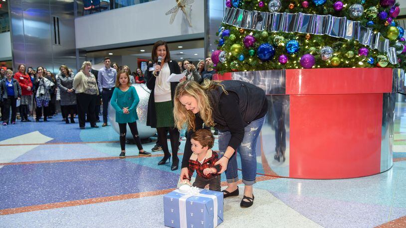 Dayton Children s Hospital hosted its second annual holiday tree lighting Monday morning, Nov. 26, 2018. One-year-old Ryan, who spent several weeks in the NICU after he was born prematurely, got the honor of lighting the tree this year. STAFF PHOTO