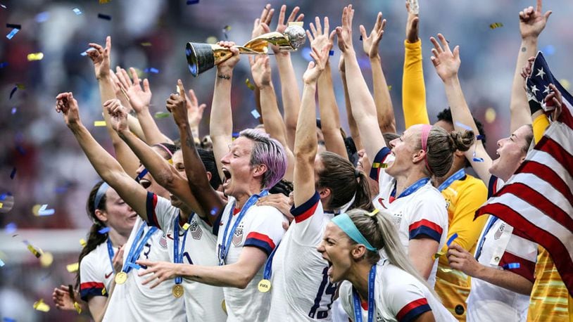 The U.S. women's soccer team celebrating their World Cup victory as Megan Rapinoe lifts the World Cup Trophy following the team's victory in the World Cup final between the U.S. and the Netherlands at Stade de Lyon on July 07, 2019 in Lyon, France.
