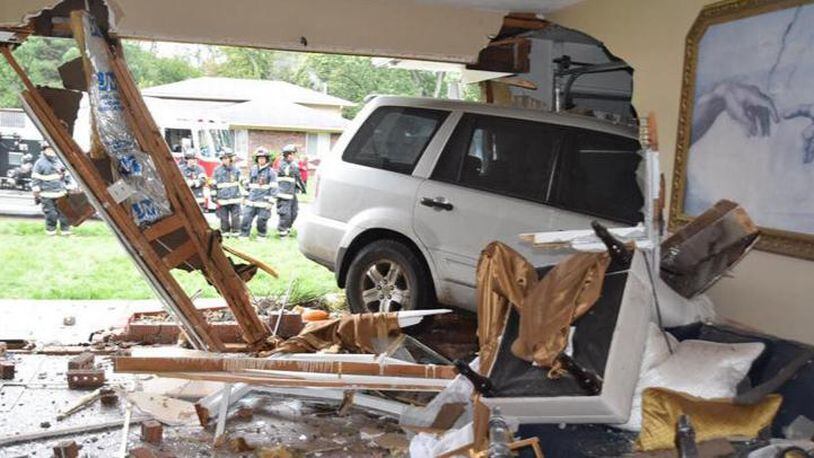 A woman driving an SUV crashed into an Indianapolis home early Monday.