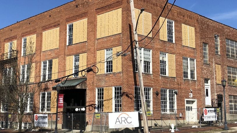 Stryker Construction and ARC, the Alexander family’s recruiting company, have signs up in front of the old shoe factory in Lebanon. STAFF/LAWRENCE BUDD