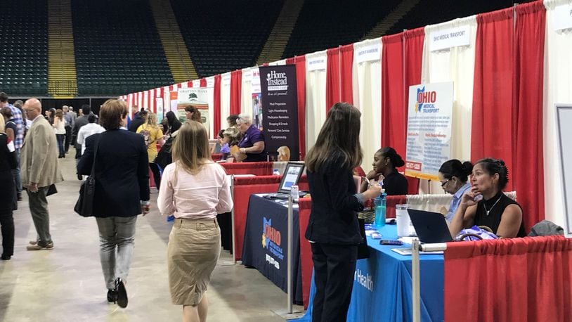 Job seekers look into positions at other job fairs. In today’s economy, workers have the upper hand.