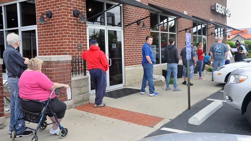 PHOTOS: Restaurants, salons reopen after coronavirus shutdowns