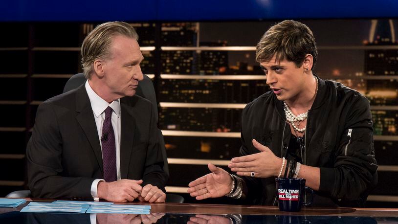 In this photo provided by HBO, host Bill Maher, left, listens to Milo Yiannopoulos, a writer for Breitbart News, on HBO's "Real Time with Bill Maher," Friday, Feb. 17, 2017, in Los Angeles. (Janet Van Ham/HBO via AP)