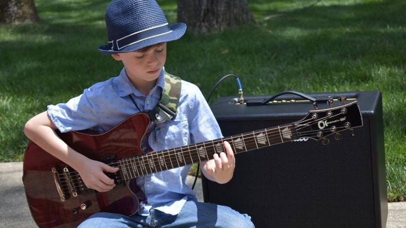 Moses Mabarak, 9, is already creating a stir in the Dayton blues community.