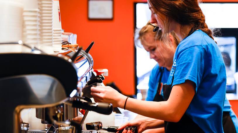 Brooklyn Oryan prepares a drink at the new Biggby Coffee location at 9433 Cincinnati Columbus Road in West Chester Township. NICK GRAHAM/STAFF