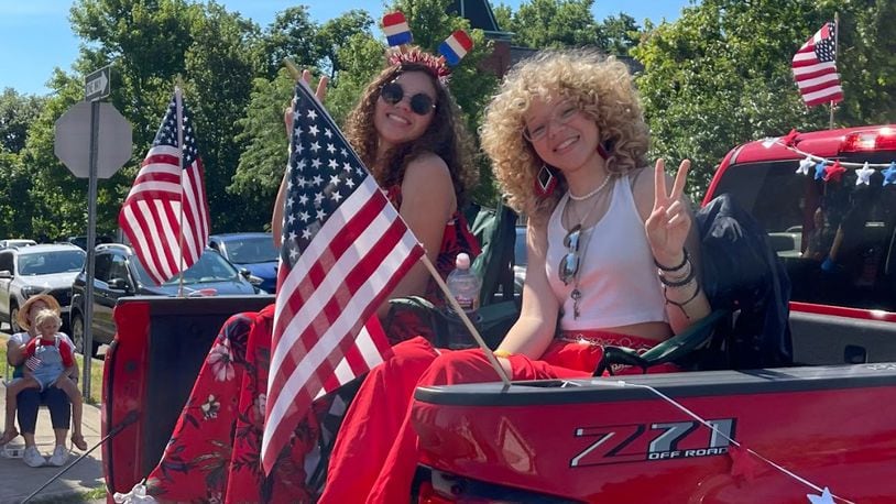 Marie, left, and Macie Cunningham, from Hamilton, singing sisters who have performed on national television, ride in the Hamilton 4th of July Parade on Mon., July 4, 2022. The parade traveled from the Butler Co. Fairgrounds to Dayton Street, Seventh Street, High and Main streets, ending at F Street. STAFF PHOTOS