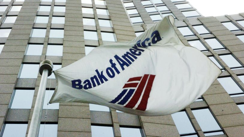 A flag flies outside the Bank of America Corporate Center June 30, 2005 in downtown Charlotte, North Carolina.