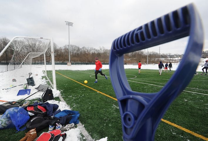 PHOTOS: Oakwood soccer players shovel snow to play