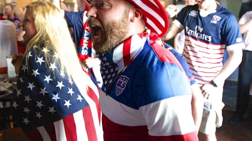Brandon Knox, of Dayton, cheers after the United States scored against Belgium in the World Cup's round of 16 during a gathering of fans at Fifth Street Brewpub in Dayton on Tuesday, July 1, 2014. David Jablonski/Staff