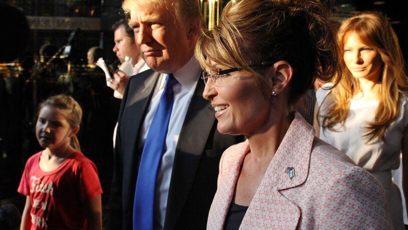 In this May 31, 2011, file photo, Donald Trump walks with former governor of Alaska Sarah Palin in New York City. The Republican presidential front-runner Trump received a key endorsement from conservative heavyweight Sarah Palin, Tuesday, Jan. 19, 2016. (AP Photo/Craig Ruttle, File)