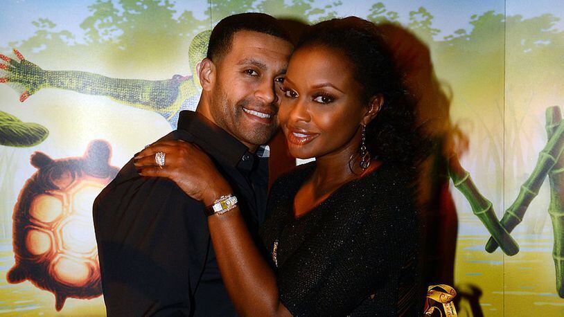 'Real Housewives of Atlanta' cast member Phaedra Parks (right) and Apollo Nida in happir times while attending Cirque du Soleil's Totem premiere at Atlantic Station on October 26, 2012 in Atlanta, Georgia.