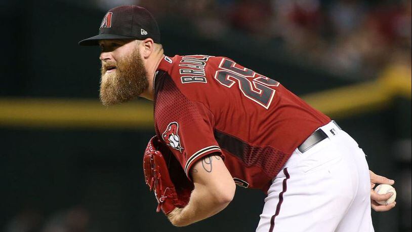Arizona Diamondback reliever Archie Bradley helped bag groceries and deliver them to customers in the parking lot of a Phoenix-area supermarket.