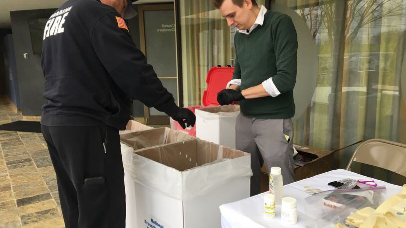 Moraine employees dump out unused pills turned in by residents on National Prescription Drug Take Back Day in 2018, FILE PHOTO