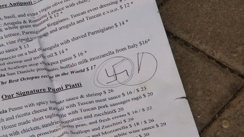 Shelley Sidney said a customer handed her a menu with a swastika drawn on it.