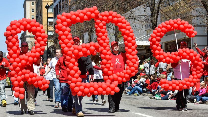 Thousands of fans lined the streets for the Reds Opening Day parade in 2016 in Cincinnati. NICK GRAHAM/STAFF