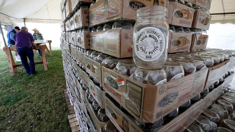Over 4,600 mason jars wait to be filled with apple butter last weekend as workers set-up for the Apple Butter Festival in Enon several years ago. Bill Lackey/Staff