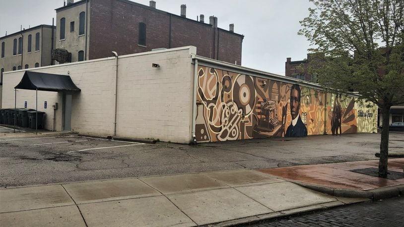 The building at 1100 W. Third St. has been granted a variance for a drive-thru on the backside of the property. The east side of the property has a large, colorful mural. CORNELIUS FROLIK / STAFF