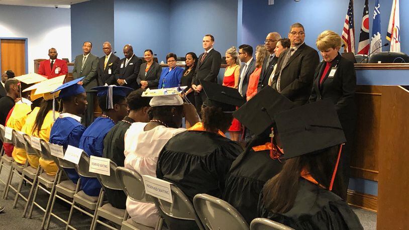 Dayton Public Schools Class of 2019 summer graduates are recognized by the school board and administration. JEREMY P. KELLEY / STAFF