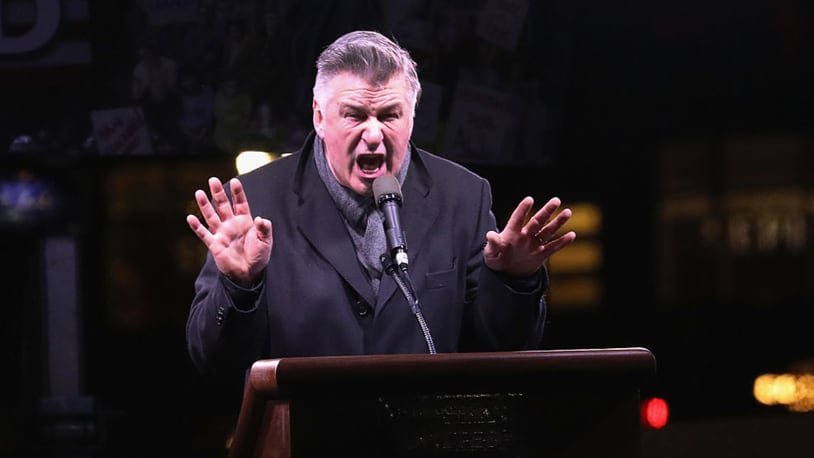 NEW YORK, NY - JANUARY 19:  Actor Alec Baldwin impersonates Donald Trump during a "We Stand United" anti-Trump rally on January 19, 2017 in New York City. Thousands of people gathered outside the Trump International Hotel in Manhattan to protest on the eve of Donald Trump's inauguration as the 45th President of the United States. Baldwin regularly impersonates Trump on "Saturday Night Live.". (Photo by John Moore/Getty Images)