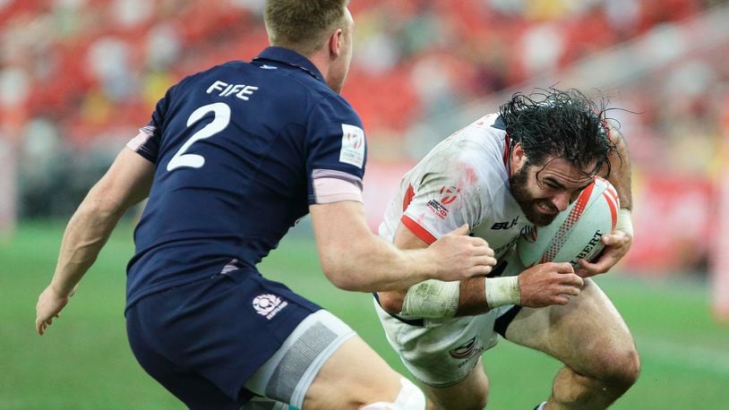 Nate Ebner, right, of the United State, tries to get past Dougie Fife, of Scotland, during the 2016 Singapore Sevens Bowl Final between United States and Scotland at National Stadium on April 17, 2016 in Singapore. (Photo by Suhaimi Abdullah/Getty Images)