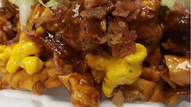 The Chicken Spot’s loaded fries comes with a choice of ‘sloppy topping’s that can includes   choice of two sauces, chopped chicken tenders, crispy bacon, shredded romaine lettuce, chopped tomatoes and pickled onions. Mac and cheese or greens can be added for  $2 each.
