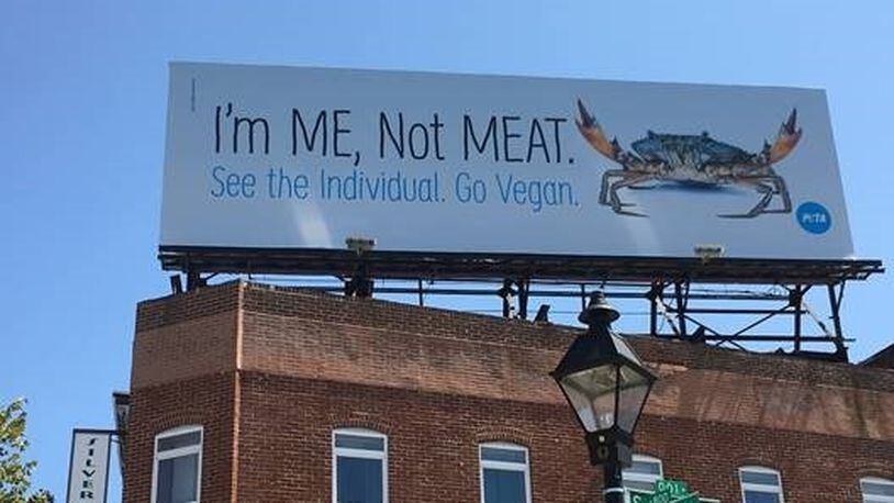 A billboard in Baltimore put up by PETA urges people to stop eating crabs.
