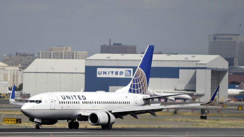 In this Sept. 8, 2015, file photo, a United Airlines passenger plane lands at Newark Liberty International Airport in Newark, N.J. United said on Monday, March 27, 2017, that regular-paying fliers are welcome to wear leggings aboard its flights, even though two teenage girls were barred by a gate agent from boarding a flight from Denver to Minneapolis Sunday because of their attire. (AP Photo/Mel Evans, File)