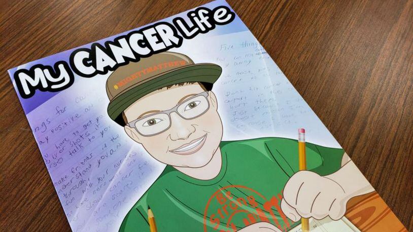 Sarah Curry Rathel, an author and founder of Smile Books Project, and illustrator Bob Kelly worked with a Carlisle Chamberlain Middle School sixth-grader to produce, “My Cancer Life.” (Photo: daytondailynews.com)