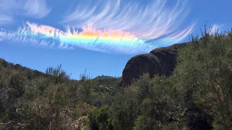A photo of a dazzling fire rainbow above Pinnacles National Park in Central California this week that was taken by a jogger and sent to the National Weather Service.
