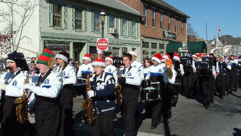 More than 60 groups - including the Miamisburg High School Marching Band - are set to be part of the city’s holiday parade Saturday. FILE PHOTO