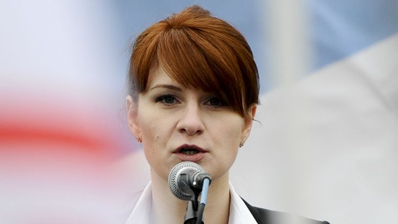 In this photo taken on Sunday, April 21, 2013, Maria Butina, leader of a pro-gun organization in Russia, speaks to a crowd during a rally in support of legalizing the possession of handguns in Moscow, Russia. Butina, a 29-year-old gun-rights activist, served as a covert Russian agent while living in Washington, gathering intelligence on American officials and political organizations and working to establish back-channel lines of communications for the Kremlin, federal prosecutors charged Monday, July 16, 2018.