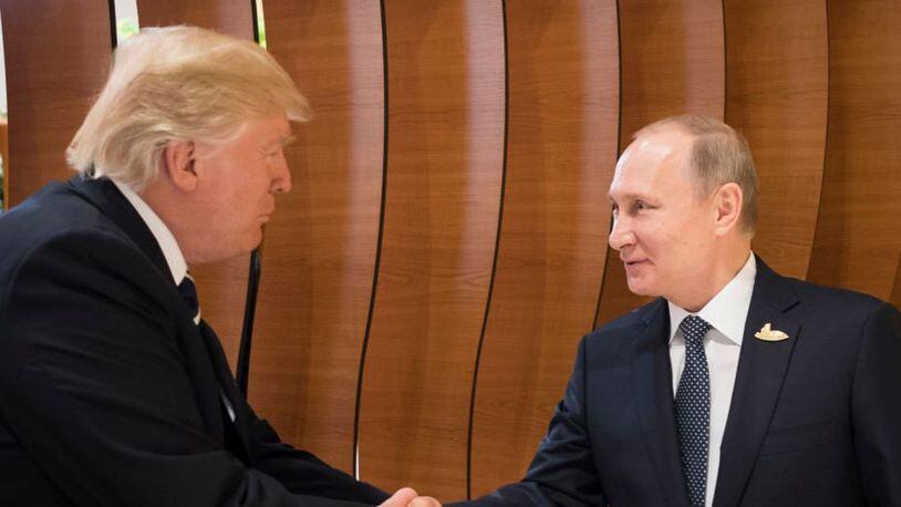 Russian President Vladimir Putin, right, is advised daily about President Donald Trump's tweets.